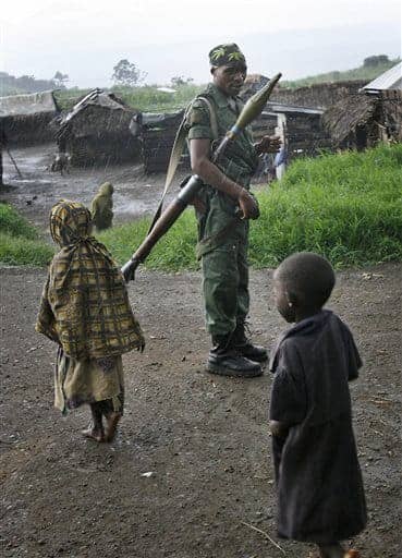 Congo-children-soldier-in-rain, Blood gadgetry: Why I am going to the Congo, World News & Views 