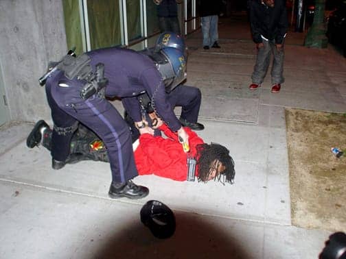 Oscar-Grant-rebellion-protester-tasered-010709-by-David-Id-IndyBay, California Assembly votes to report on human rights to U.N. committees, News & Views 