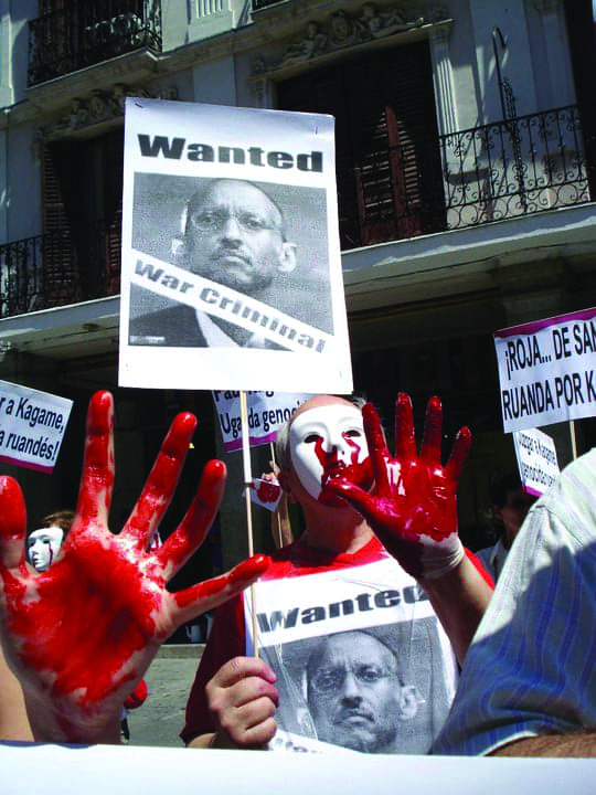 Anti-Kagame-protest-in-Spain-‘bloody’-hands-0710, Kagame sworn in after U.N. report of guilt in Congo genocide, World News & Views 