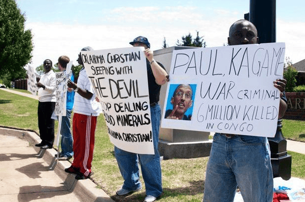 Anti-Kagame-protest-at-Oklahoma-Christian-University-signs-re-Congo-war-crimes-043010-by-Kendall-Brown, Paul Kagame’s desperate days, World News & Views 