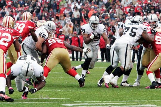 RB-Michael-Bush-finds-gap-created-by-offensive-line-101710-by-Tony-Gonzales, 49ers win Battle of the Bay, Culture Currents 