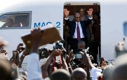 Haiti-Aristide-exits-plane-031811-by-Alexandre-Meneghini-AP, Against all odds Aristide returns to Haiti, World News & Views 
