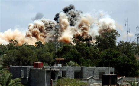Tripoli-bombed-in-NATO-air-raid-052411-by-AFP, NATO: A feast of blood, World News & Views 