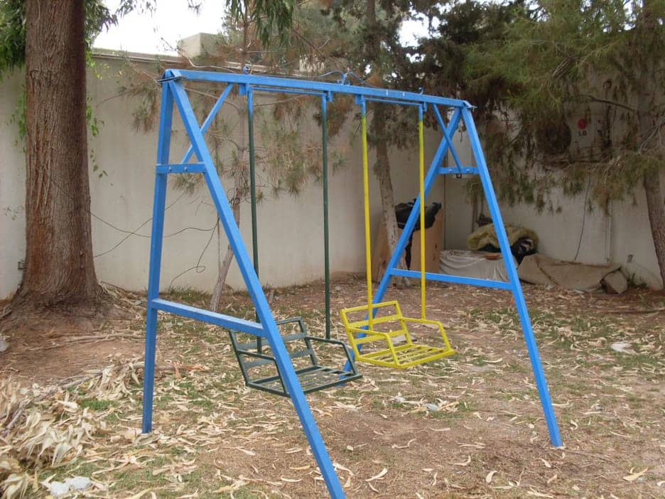 Childrens-swing-set-at-Mrs.-Qaddifis-house-bombed-043011-by-Wayne-Madsen, Cynthia McKinney’s truth dispatches from Libya: Days 1-3, World News & Views 