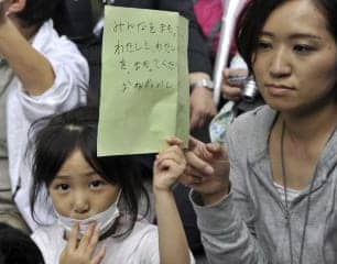 Fukushima-girl-holds-petition-for-protection-of-children-at-Education-Ministry-Tokyo-052311-by-Yoshikazu-Tsuno-AFP-Getty1, Question marks, the elephant in the room and the refusal of nuclear power defenders to consider what has happened to people and the environment since Fukushima and Chernobyl, News & Views World News & Views 