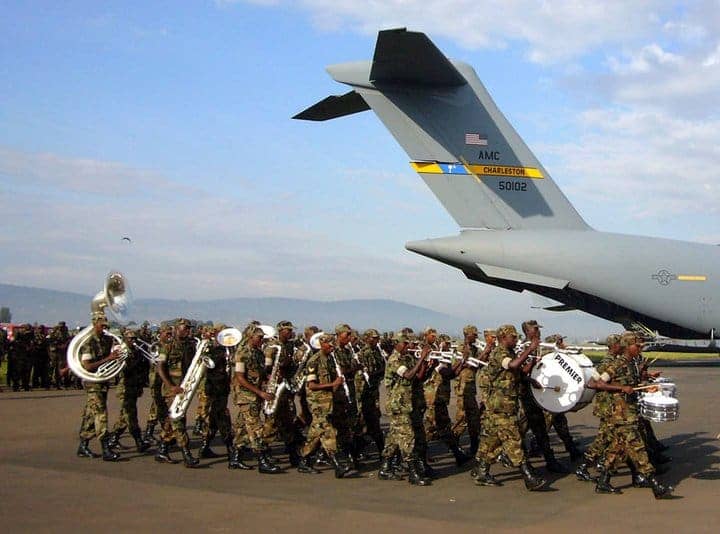 Rwandan-army-band-plays-as-Rwandan-soldiers-board-US-military-plane-to-Sudan-by-AFRICOM, Rwanda is no excuse for the U.S. to intervene in Sudan, World News & Views 