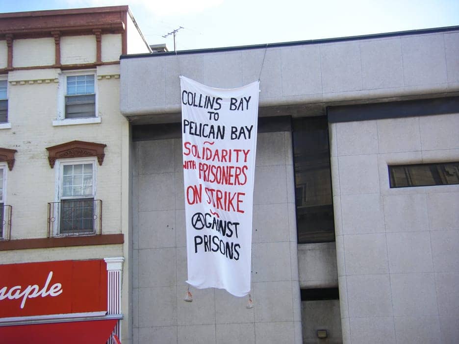 Solidarity-banner-from-Collins-Bay-Fed-Pen-Kingston-Ont.-to-Pelican-Bay-SP-hunger-strikers-overlooks-Kingston-City-Hall-070411, Make some noise: International solidarity for Pelican Bay Hunger Strike!, Behind Enemy Lines 