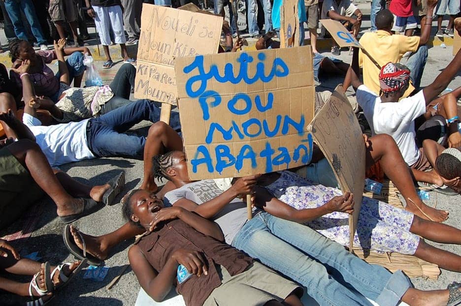 Haiti-homeless-Camp-Django-Delmas-17-PAP-block-Delmas-road-protest-eviction-080111-by-Gaetantguevara-web, Wave of illegal, senseless and violent evictions swells in Port au Prince, World News & Views 