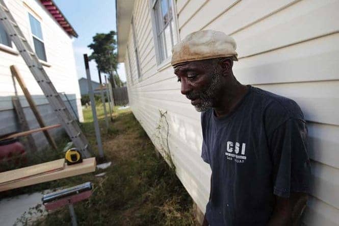 Michael-Cormick-working-alone-with-son-6-years-restoring-home-082611-by-Chris-Granger-New-Orleans-Times-Picayune, Katrina Pain Index 2011: Race, gender, poverty, World News & Views 