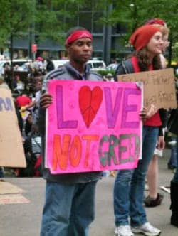 Occupy-Wall-St-young-Black-mans-sign-Love-not-greed.jpg