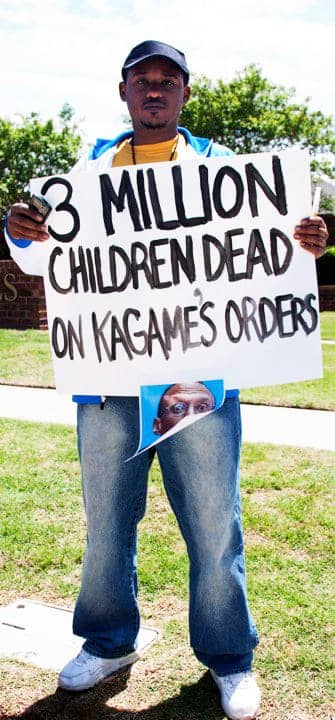 Anti-Kagame-protest-at-Okla.-Christian-Univ.-Claude-Gatebuke-3-mil-children-dead-sign-re-Congo-043010-by-Kendall-Brown, Worse than Penn State, World News & Views 