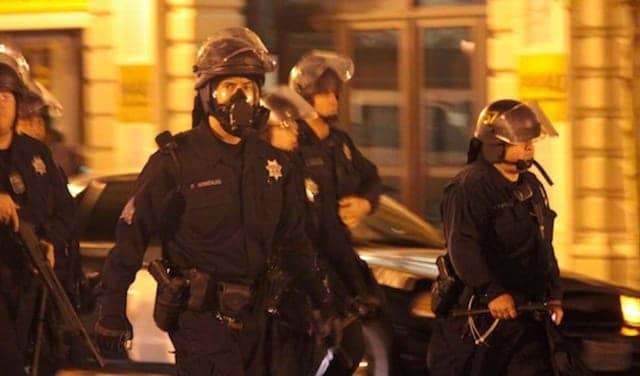 Occupy-Oakland-v.-cops-Sgt.-Patrick-Gonzalez-ctr-shot-4-3-fatally-in-13-yrs-102511-by-Ali-Winston, The police raid on Occupy Oakland was nothing new for this city, Local News & Views 