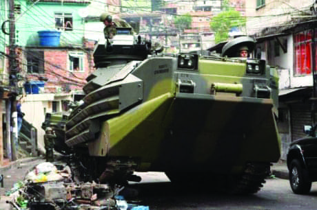 MINUSTAH-Brazilian-Navy-armored-vehicle-patrols-Rocinha-favela-111311-by-Marcelo-Sayao-EPA, What happens in Haiti doesn’t stay in Haiti, World News & Views 