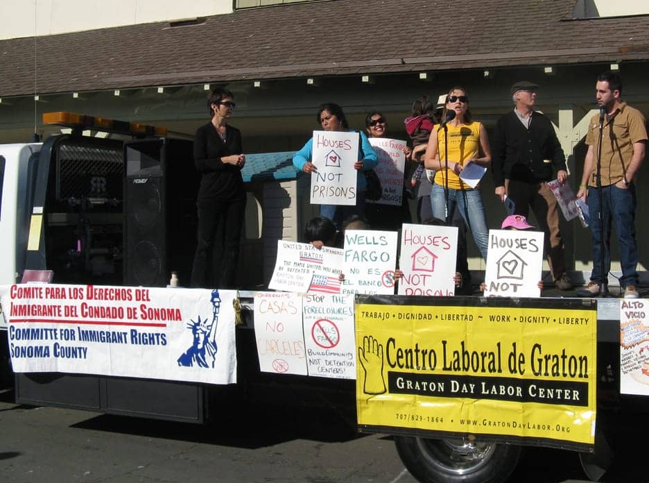 Rally-against-Wells-Fargo’s-private-prison-investment-L-R-ASL-interpreter-2-women-Women’s-Collective-at-Graton-Day-Labor-Center-Maureen-Purtell-Rick-Coshnear-Jesus-Guzman-010612-by-Attila-Nagy, Wells Fargo, king of private prisons, shut down for the day; seven arrested, Local News & Views 