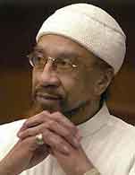 Imam-Jamil-Al-Amin-in-white, Imam Jamil Al-Amin on El Hajj Malik El Shabazz (Malcolm X) – Rally Monday to bring him home, Behind Enemy Lines 