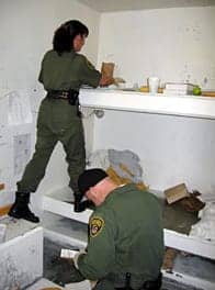 Pelican-Bay-SHU-guards-search-cell-for-binder-clip-weapon-2006-by-Laura-Sullivan-NPR, Prisoners tell the world about the horrors of California prison isolation, Behind Enemy Lines 