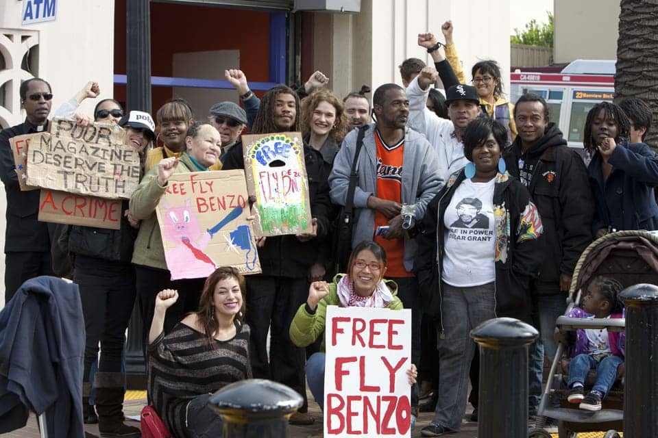 Free-Fly-Benzo-press-conf-rally-Mendell-Plaza-back-Franzo-King-Tiny-Denika-Mesha-Larry-Felson-Fly-Severa-Keith-Alex-Schmaus-Kilo-Marco-Scott-Sharena-Thomas-Kelley-TaLea-Monet-front-Rebecca-Kitty-Lui-041812-by-Malaika-web, Dregs One’s ‘Wake Up Report on Police Brutality’ features Fly Benzo, Culture Currents 