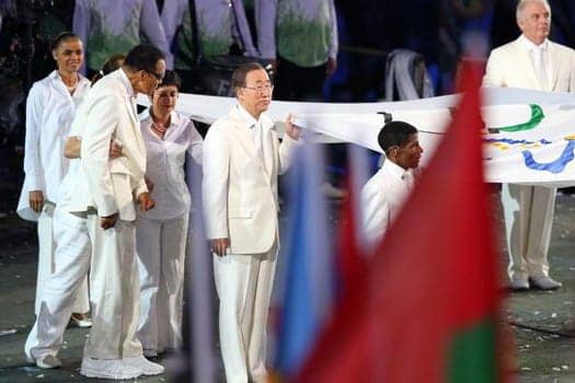 2012_Olympics_London_Muhammad_Ali_helps_carry_Olympic_flag_in_opening_ceremony_072712_by_Getty, Fists of freedom, an Olympic story not taught in school, Culture Currents 