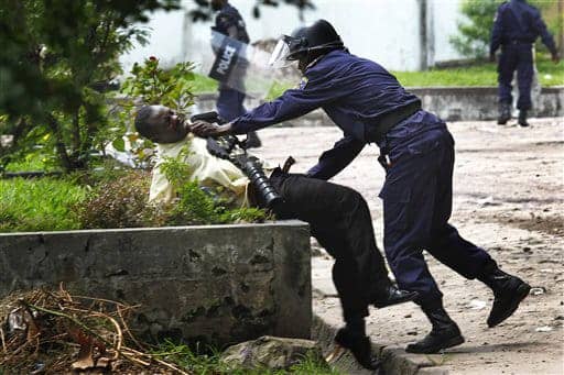 Congo-election-Tshisekedi-supporter-attacked-outside-his-HQ-Kinshasa-by-riot-cop-120811-by-Jerome-Delay-AP, Congo: Elections, democracy and the Diaspora awakening, World News & Views 