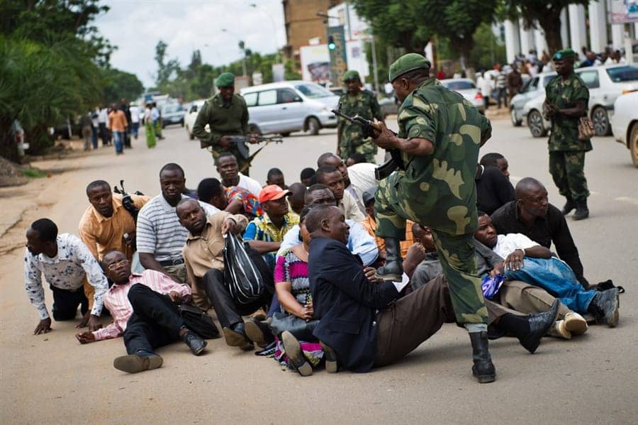 Congolese-soldier-stomps-Fabien-Mutomb-provincial-VP-Union-for-Democracy-and-Social-Progress-UDPS-Tshisekedi’s-party-peaceful-protest-Lubumbashi-121411-by-Getty, Congo: Elections, democracy and the Diaspora awakening, World News & Views 
