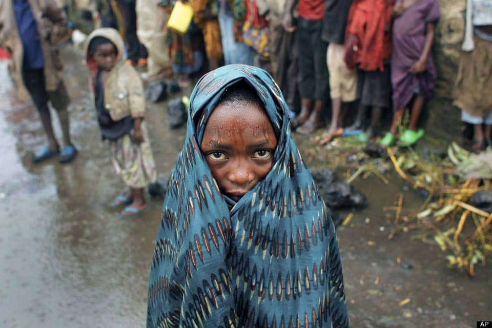 Drenched-Congolese-child-Kibati-north-of-Goma-eastern-Congo-080812-by-Jerome-Delay-AP, Congo Genocide: Will Obama’s America collaborate or refuse?, World News & Views 