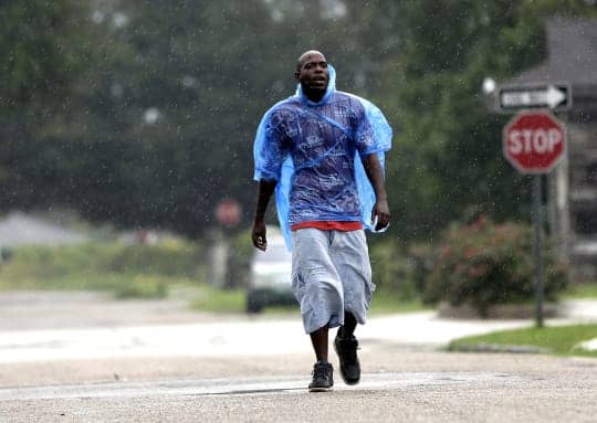Hurricane_Isaac_New_Orleans_Lower_9th_Terry_Dickson_as_storm_approaches_082812_by_David_J._Phillip_AP, Seven years after Katrina, a divided city, News & Views 