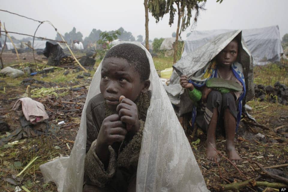 IDP-camp-children-in-rainstorm-Kibati-north-of-Goma-eastern-Congo-080812-by-Jerome-Delay-AP, Congo Genocide: Will Obama’s America collaborate or refuse?, World News & Views 