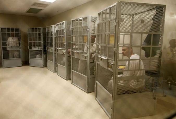 Ad-seg_prisoners_caged_for_group_therapy_San_Quentin_060812_by_Lucy_Nicholson_Reuters, Amnesty International report condemns shocking conditions in California SHUs, Behind Enemy Lines 