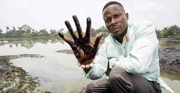 Niger-Delta-man-oiled-hand, Court finds Shell Nigeria guilty, World News & Views 
