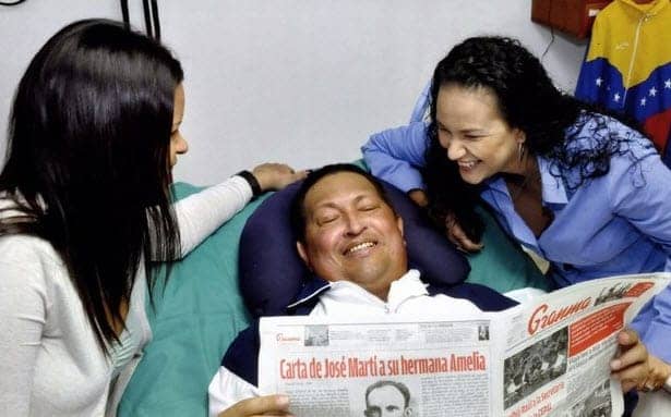 Hugo-Chavez-daughters-in-Cuba-hospital-reading-Granma-021413-2-by-Prensa-Presidencial, First images released of Venezuelan President Chavez since his operation, World News & Views 