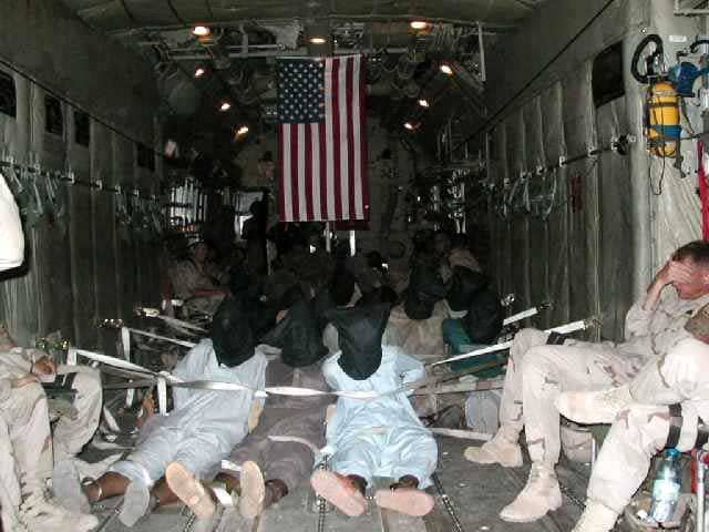 POWs-bags-on-heads-fly-to-Guantanamo, Sensory deprivation: an unnatural death, Abolition Now! 