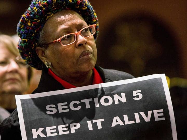 Woman-holds-sign-Section-5-Keep-it-alive-as-Supreme-Court-hears-Voting-Rights-Act-challenge-022713, Supreme Court hears Voting Rights Act challenge: The legal fight to protect white power, News & Views 