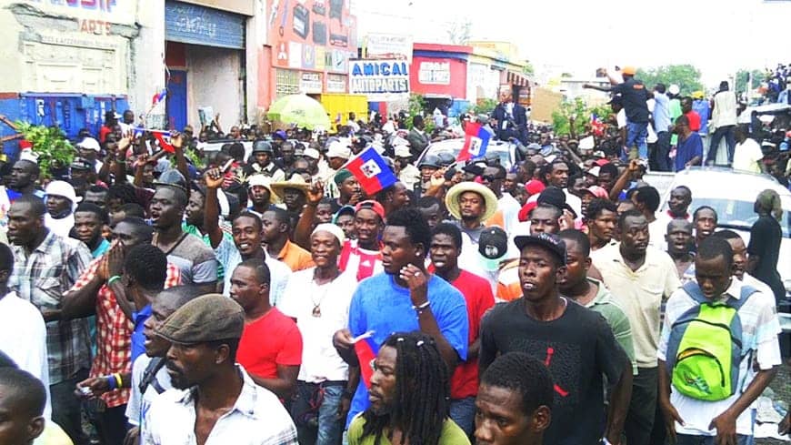Aristide-summoned-to-court-thousands-of-Haitians-surround-his-car-050813, Stop the attacks on President Aristide and Haiti’s grassroots movement, World News & Views 