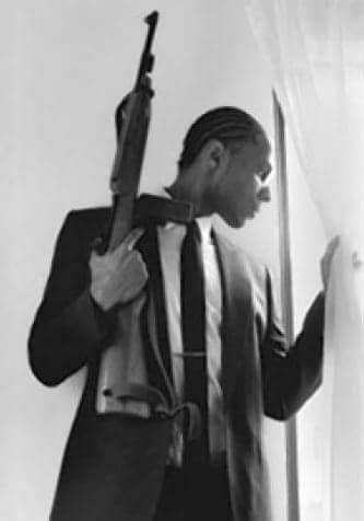 Malcolm-Shabazz-in-replica-of-Malcolm-X-at-window-with-rifle-pic-posted-to-Malcolms-Twitter-page, Remembering young Malcolm – with love, News & Views 