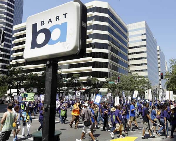 Striking-BART-City-of-Oakland-workers-close-14th-Bway-070113-by-Ben-Margot-web, Rolling back the Civil Rights Movement, with BART workers as a major target, Local News & Views 