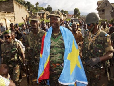 Congolese-drape-flag-Col.-Mamadou-N’Dala-Moustafa-after-M23-defeat-1113, ‘Declaration’ would contract DRC to concede to M23 (with French translation), World News & Views 