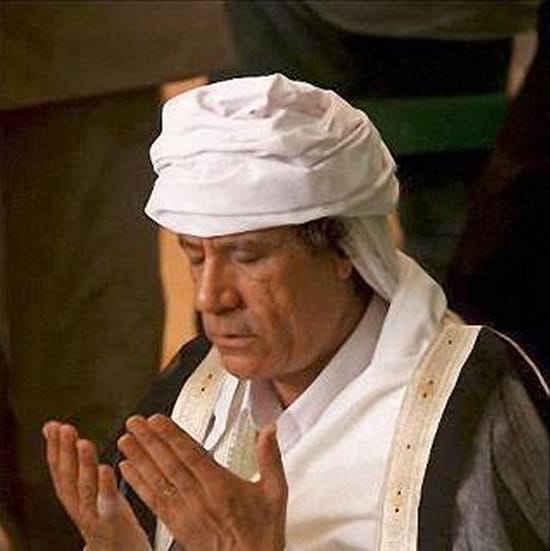 Muammar-Al-Qaddafi-in-prayer, New Year’s message from Muammar Al Qaddafi, World News & Views 