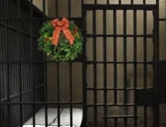 Prison-cell-with-Christmas-wreath, You got to surrenda?, Abolition Now! 