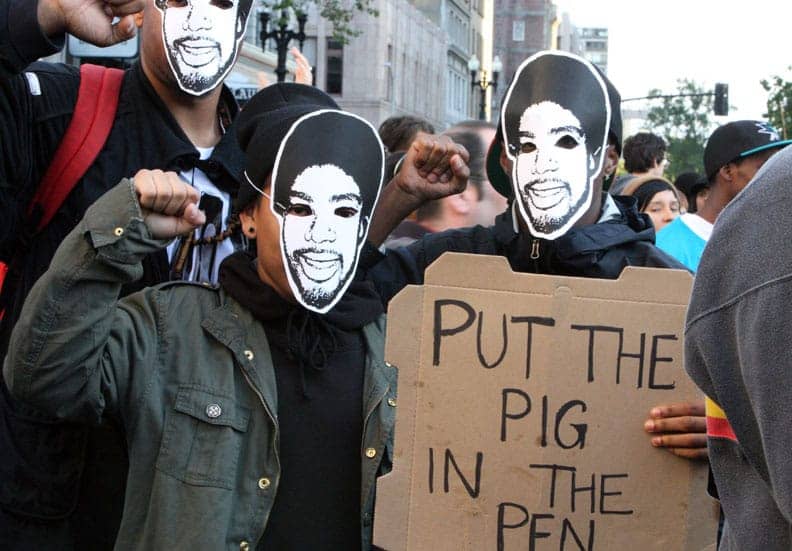 Oscar-Grant-Mehserle-verdict-rebellion-youngsters-in-OG-masks-Put-pig-in-pen-sign-070810-by-Malaika, Five years after the Oscar Grant murder: Author of ‘No Doubt: The Murder(s) of Oscar Grant’ speaks ..., Culture Currents 