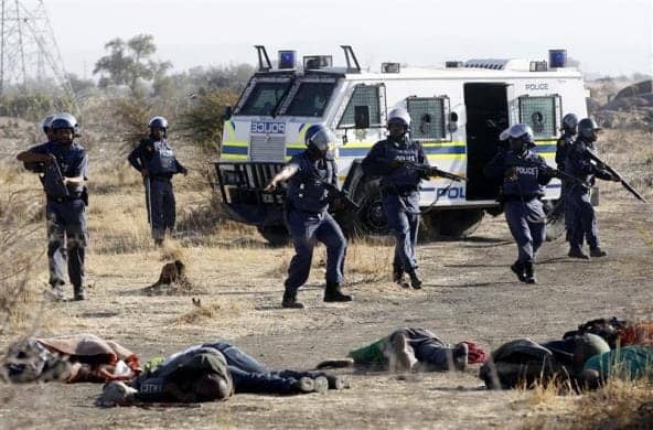 Marikana-mine-workers-police-approach-dead-miners-081612-by-Siphiwe-Sibeko-Reuters, From Marikana, South Africa, to Oakland, California: The struggle for workers’ power, Local News & Views 