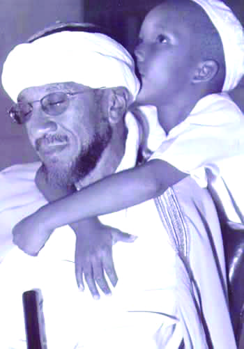 Imam-Jamil-Al-Amin-and-son, Free Imam Jamil Al-Amin! His wife, attorney Karima Al-Amin, tells of the US’ 47-year campaign to silence H. Rap Brown, Behind Enemy Lines 