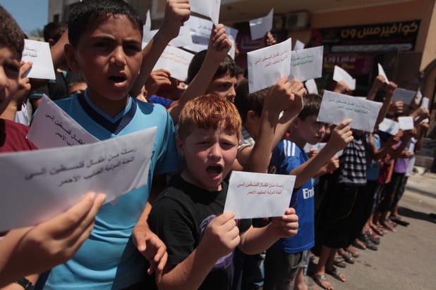 Palestinian-children-deliver-messages-to-Gaza-City-ICRC-for-hunger-strikers-061814-by-Ashraf-Amra-APA, From Palestine to Pelican Bay, prisoners and their loved ones fight for justice and freedom, Abolition Now! 