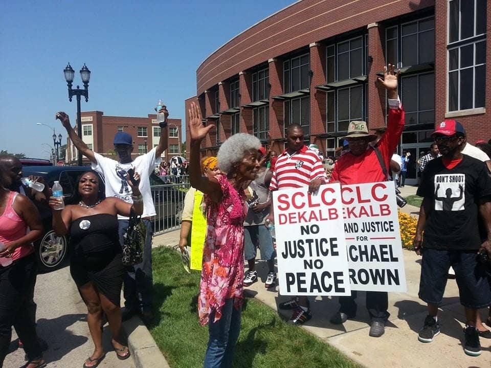 Michael-Brown-funeral-old-woman-hands-up-shows-support-for-youth-082514-by-JR-BR, Why Ferguson is the Congo, World News & Views 