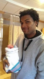 John-Crawford-with-his-baby-168x300, No charges in Ohio police killing of John Crawford as Wal-Mart video contradicts 911 caller account, News & Views 