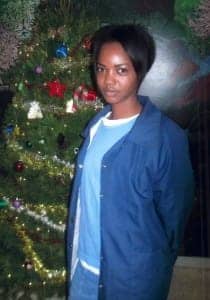 Christy-Phillips-with-Christmas-tree-210x300, Woman prisoner reveals torture of children by police and juvenile authorities, Abolition Now! 