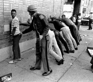 Cop-frisks-Black-youth-lined-up-hands-on-wall-300x263, On racism, resistance and state violence: a discussion on the politics of greed and hate, Behind Enemy Lines 