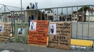 Occupy-San-Quentin-signs-decrying-solitary-022012-by-Bastique-Flickr-300x168, What is solitary confinement?, Behind Enemy Lines 