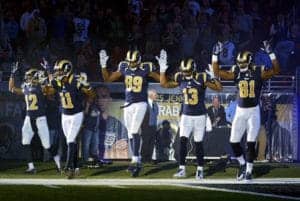 St.-Louis-Rams-players-Stedman-Bailey-Tavon-Austin-Jared-Cook-Chris-Givens-Kenny-Britt-Hands-up-dont-shoot-before-Oakland-Raiders-game-113014-by-Jeff-Curry-USA-Today-Sports-300x201, Put those police cameras on the bankers, News & Views 