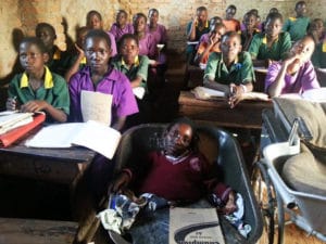 Eunice-Atim-in-school-with-both-wheelbarrow-wheelchair-front-view-1214-by-Ronald-Galiwango-300x225, Wheelchair mobility plus education equals a bright future for Eunice Atim of Uganda, World News & Views 