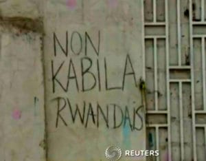 Non-Kabila-Rwandais-graffiti-Kinshasa-0115-by-Reuters-300x234, Congolese protest election delay: ‘Non Kabila Rwandais’, World News & Views 